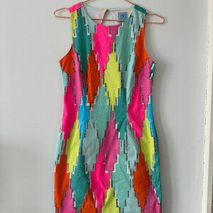 Vintage 70s-inspired neon open-back minidress